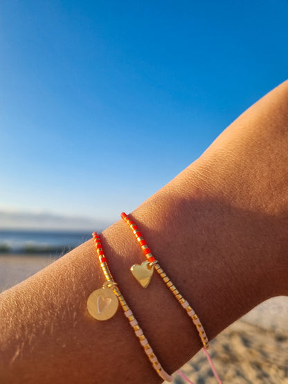 Pulsera miyuki tonos rosados y naranjas corazón